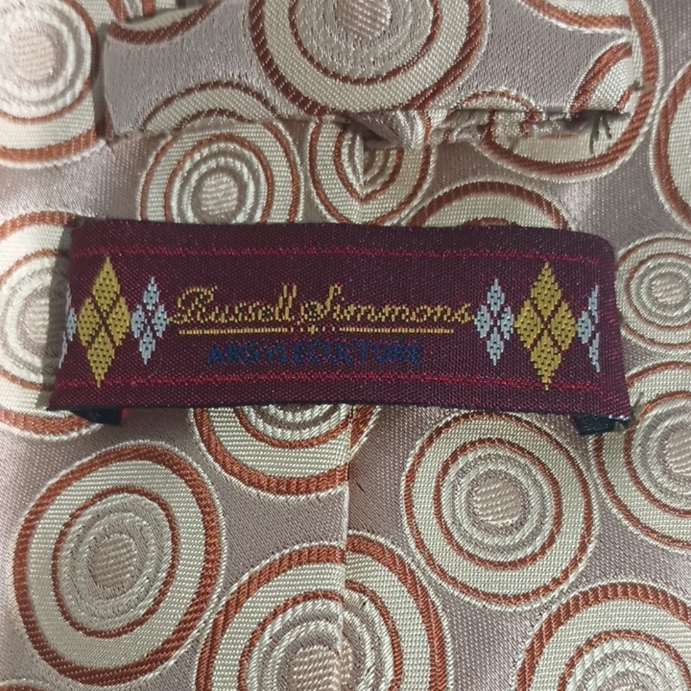 Russell Simmons Outstanding tan,gold and brown concentric circle Patterned Tie.